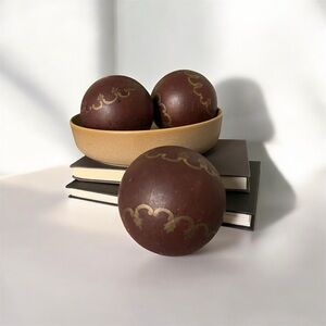 Set of  (3) decorative balls, with a hand-painted gold filigree design. Preowned